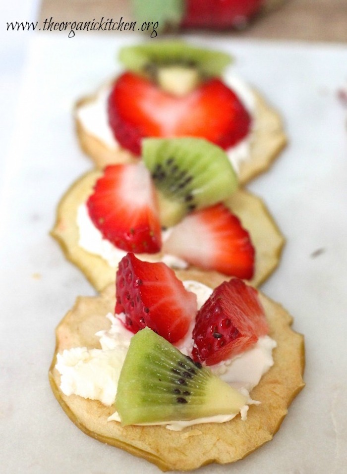 Dried apples with cream cheese, strawberries and kiwi fruit as part of a Fruit, Chocolate and Cheese Dessert Platter