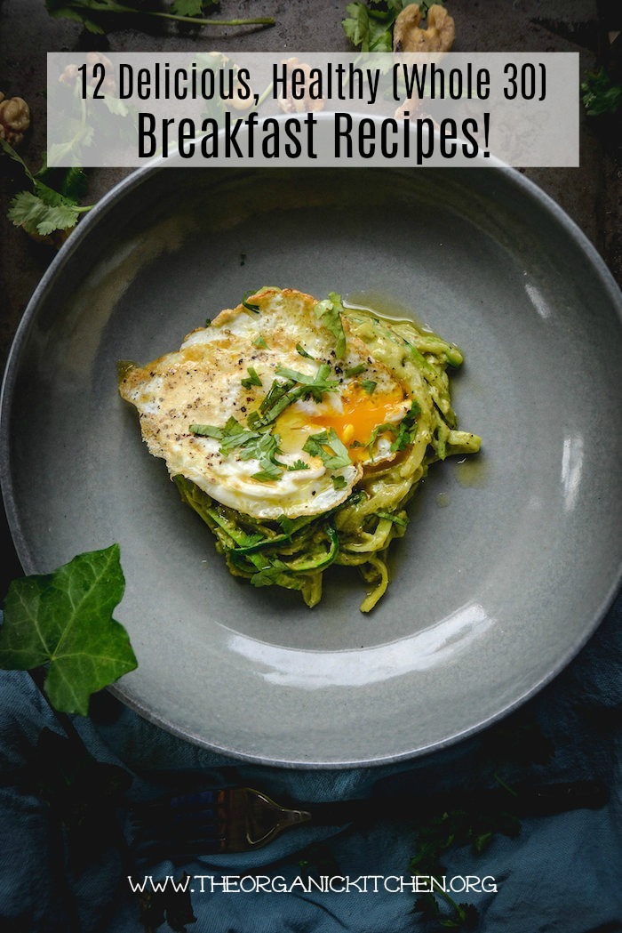 Zucchini noodles and fried egg on a grey plate as part of 12 Healthy, Delicious (Whole 30) Breakfast Recipes