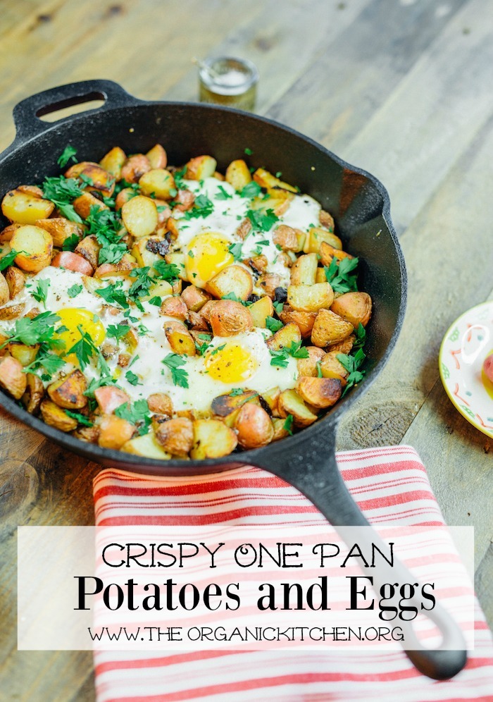 Crispy One Pan Potatoes and Eggs in a black cast iron skillet topped with parsley garnish