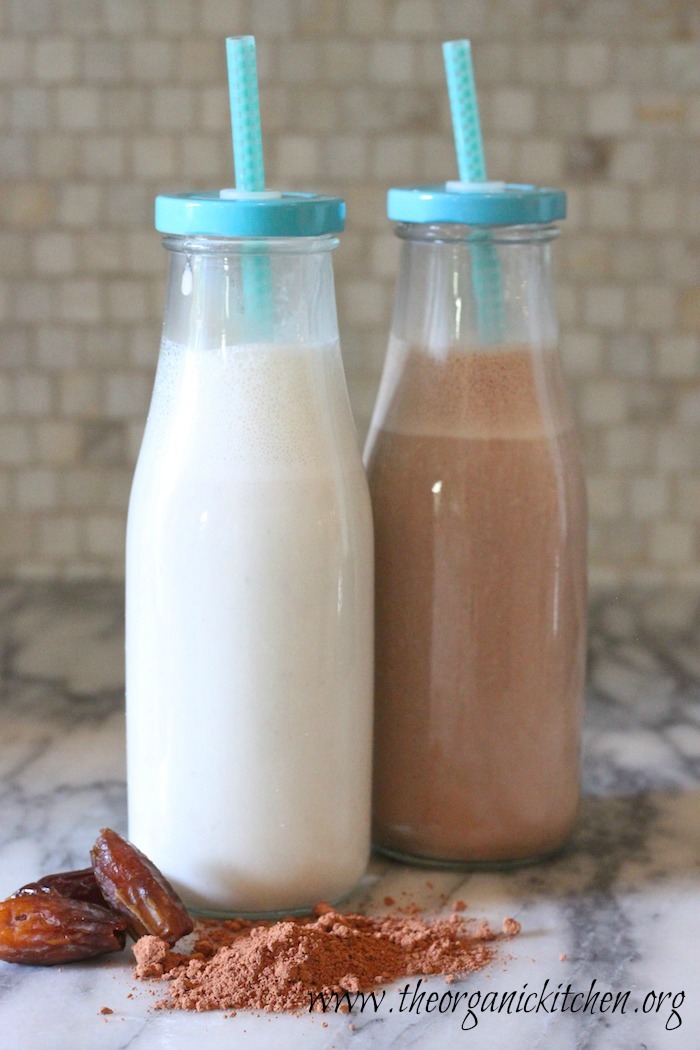 How to Make Almond Milk: Two bottle of almond milk, one vanilla, one chocolate on marble counter