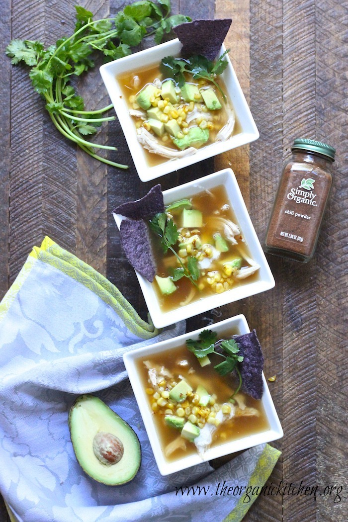 Three bowls of 15 Minute Chicken Tortilla Soup surrounded bt cilantro 