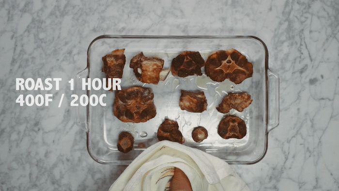 Cooked beef bones in a clear baking dish