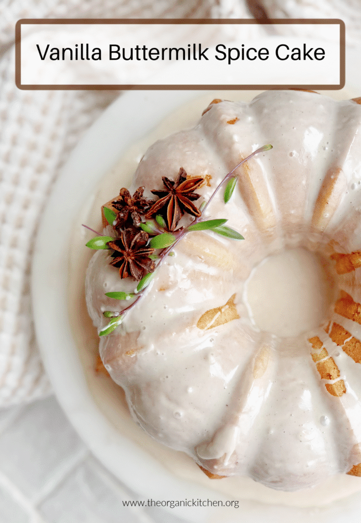 Vanilla Buttermilk Spice Cake: on white cake plate with dish towel in the background