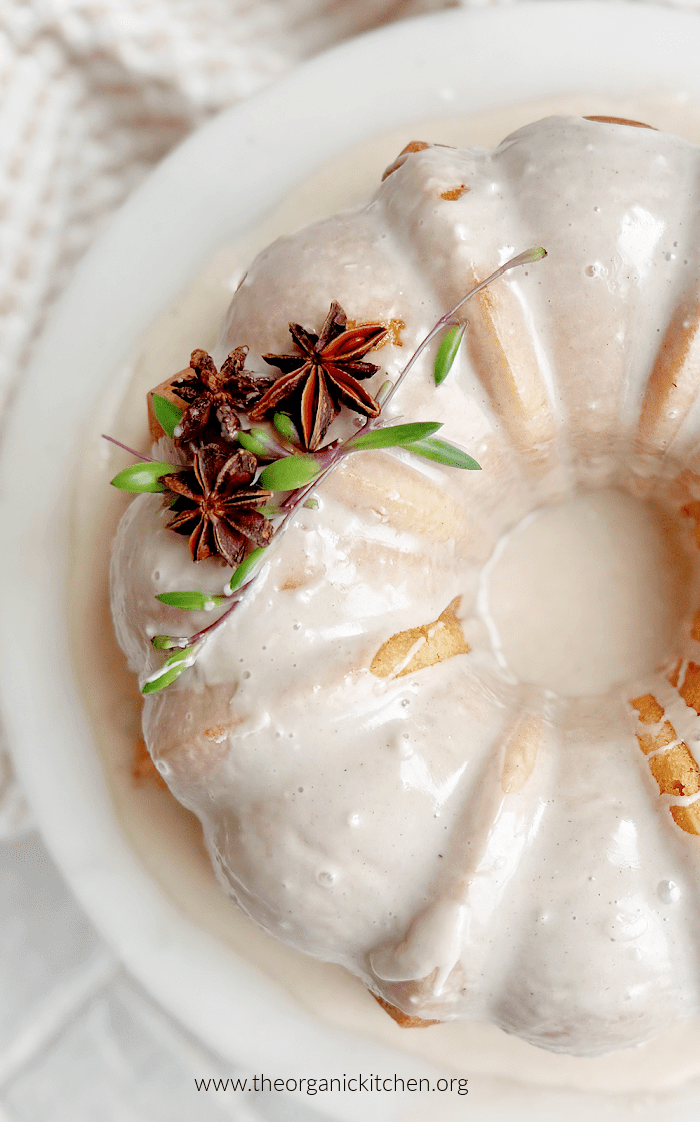 Vanilla Buttermilk Spice Cake decorated with star anise and succulents on white cake plate