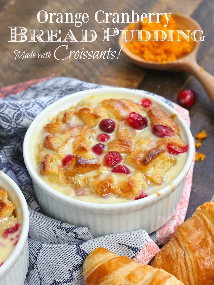 Orange Cranberry Bread Pudding: Made with Croissants in a white ramekin