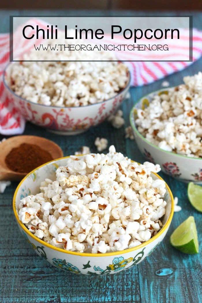 Stovetop Chili Lime Popcorn in three bowls on blue table