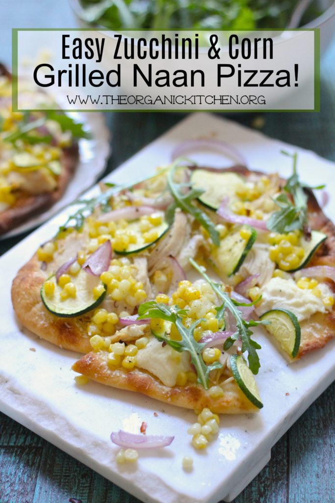 Easy Zucchini & Corn Grilled Naan Pizza on a white cutting board