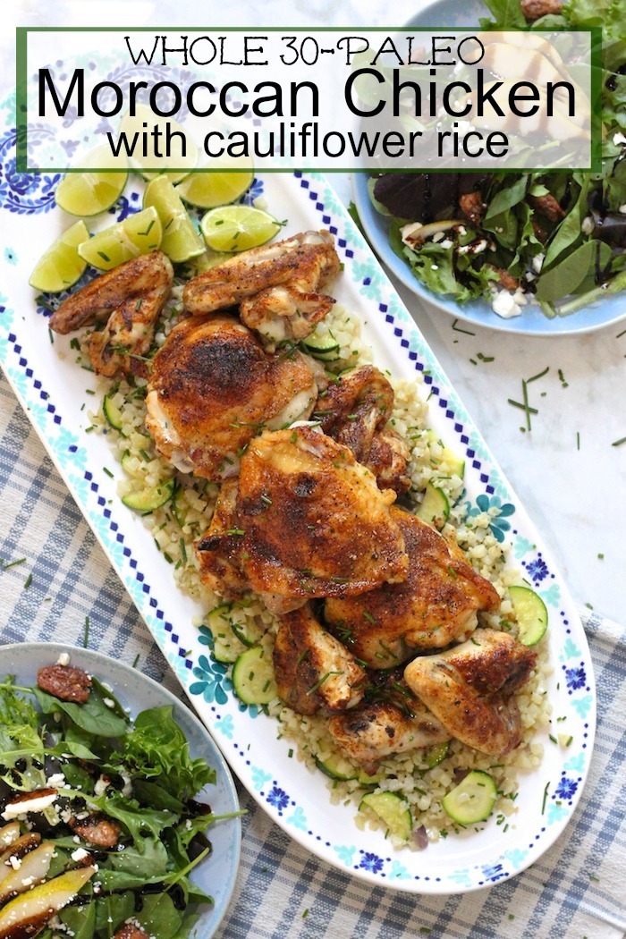 Moroccan Chicken and Cauliflower Rice Platter on table surrounded by salad