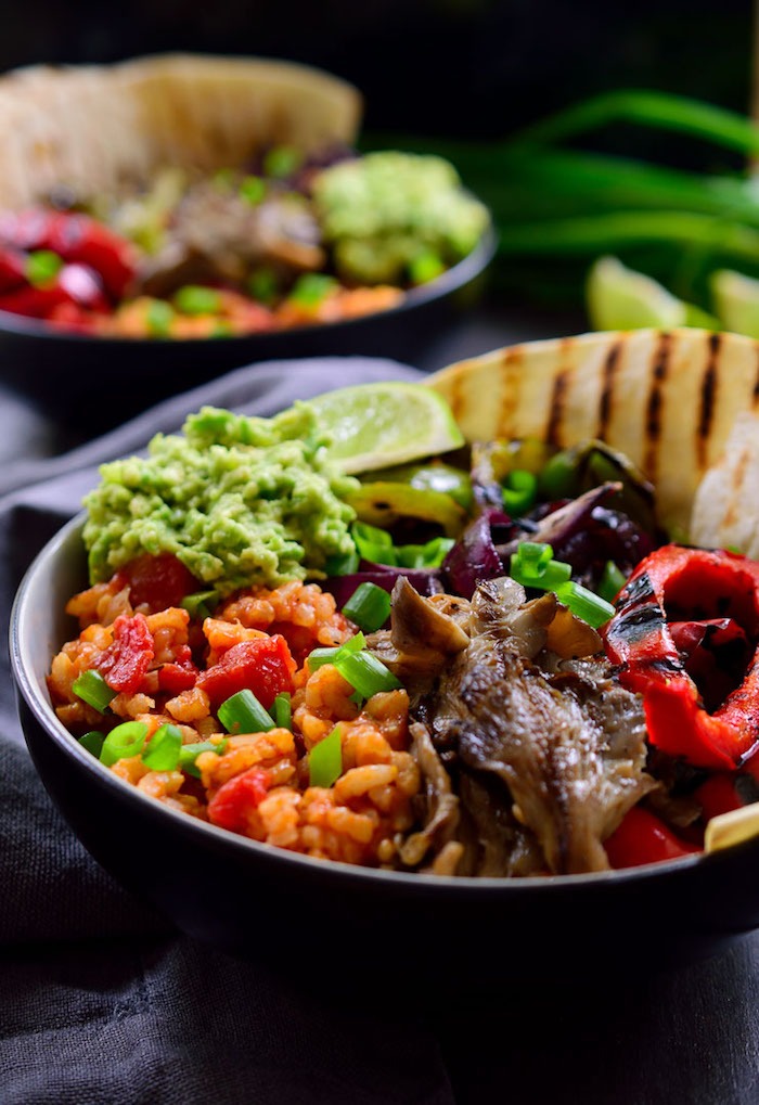 A taco bowl with rice, red peppers, and guacamole as part of 50+ Taco, Tostada and Fajita Recipes!