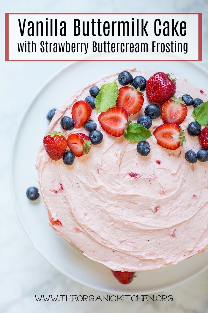 Vanilla Buttermilk Cake with Strawberry Buttercream Frosting on white cake plate