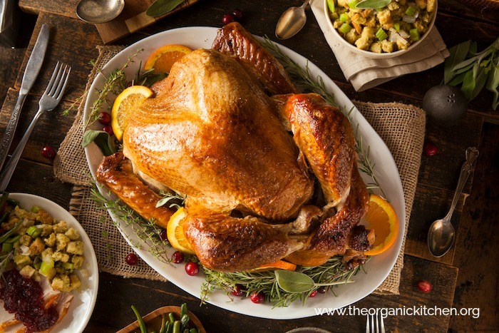 Everything You Need for Your Holiday Feast on a wood table with silverware