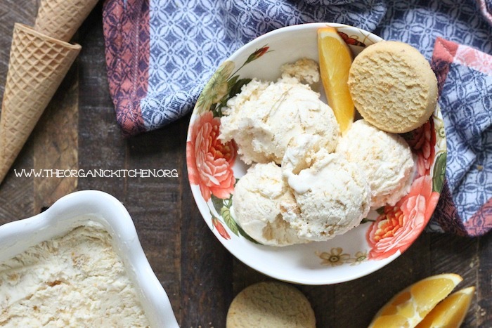 Orange-Shortbread Cookie 'No Churn' Ice Cream in small bowl with a shortbread cookie and orange slice