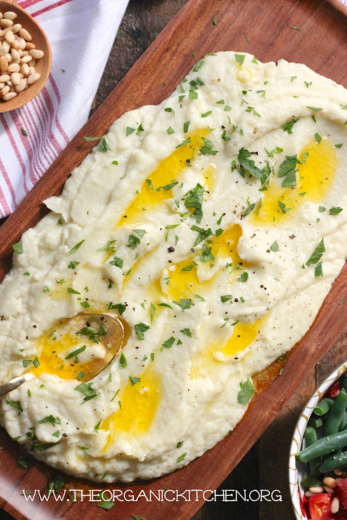 A close up of Cauliflower Purée drenched in melted butter