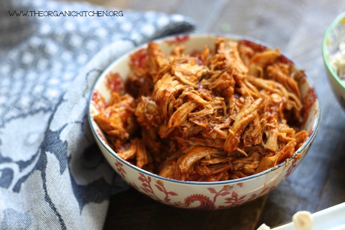 BBQ Pulled Chicken Sandwiches and Slaw in a bowl on wooden table