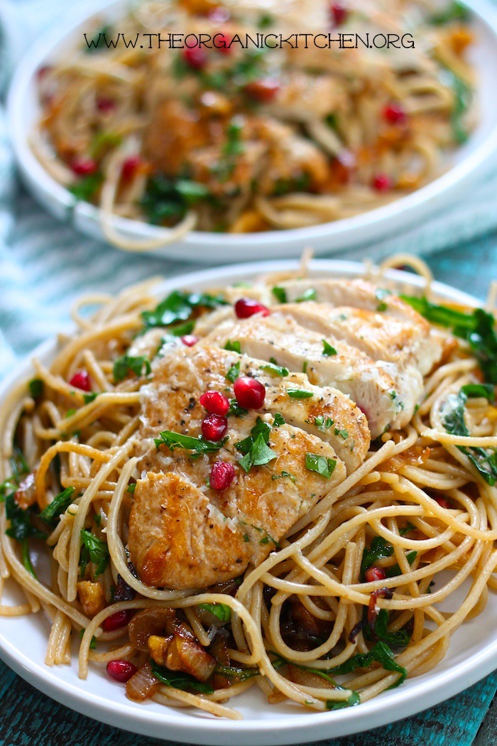 Two white plates overflowing with Pasta with Chicken, Caramelized Onions and Balsamic