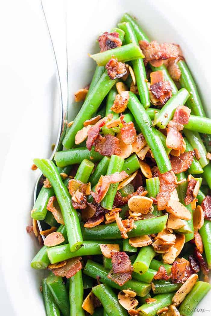 Green beans with bacon in white dish as part of 12 Healthy Whole 0 Vegetable Side Dishes! 