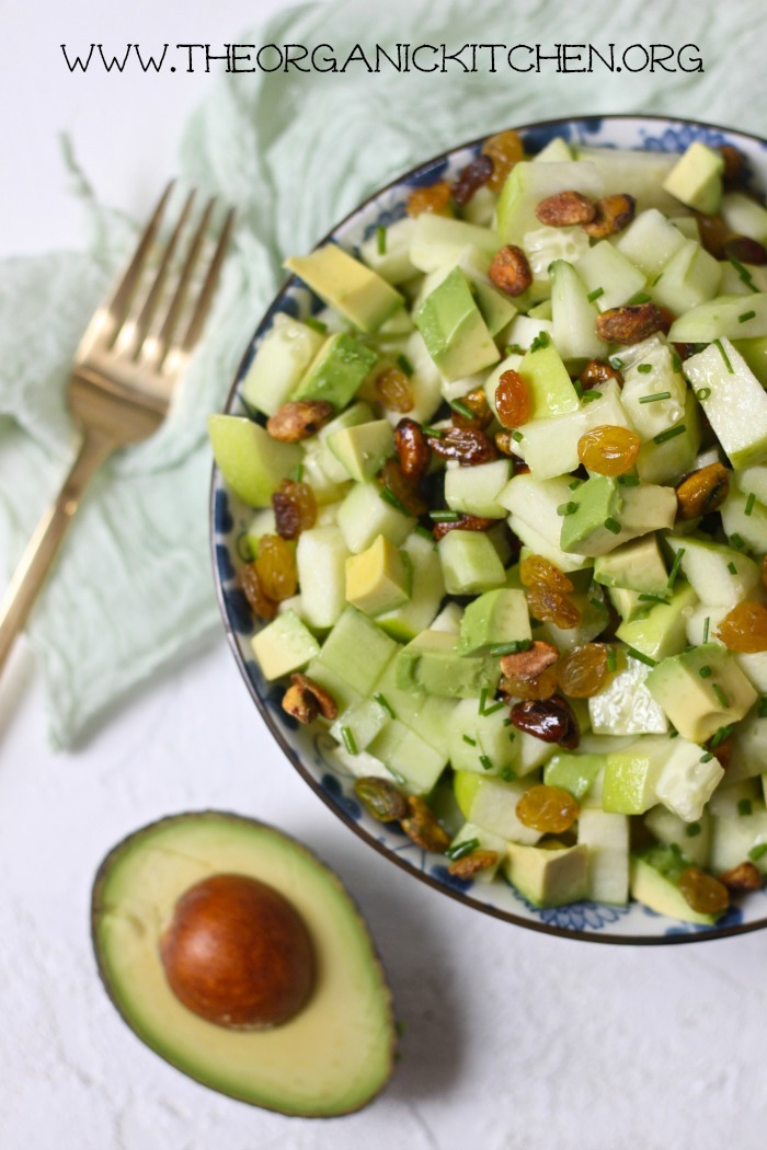 A bowl of the Five Greens Salad ~ Paleo/ Whole 30 with a gold fork and green dish towel in background