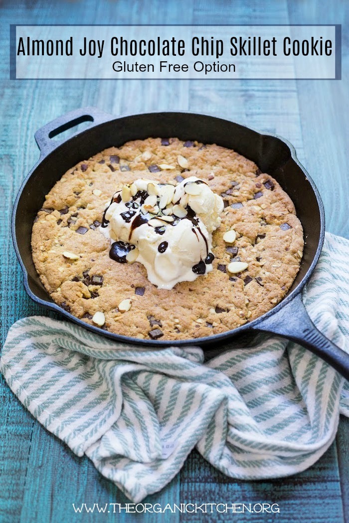 'Almond Joy' Chocolate Chip Skillet Cookie! (Gluten free option) in a black cast iron skillet set on blue wood table