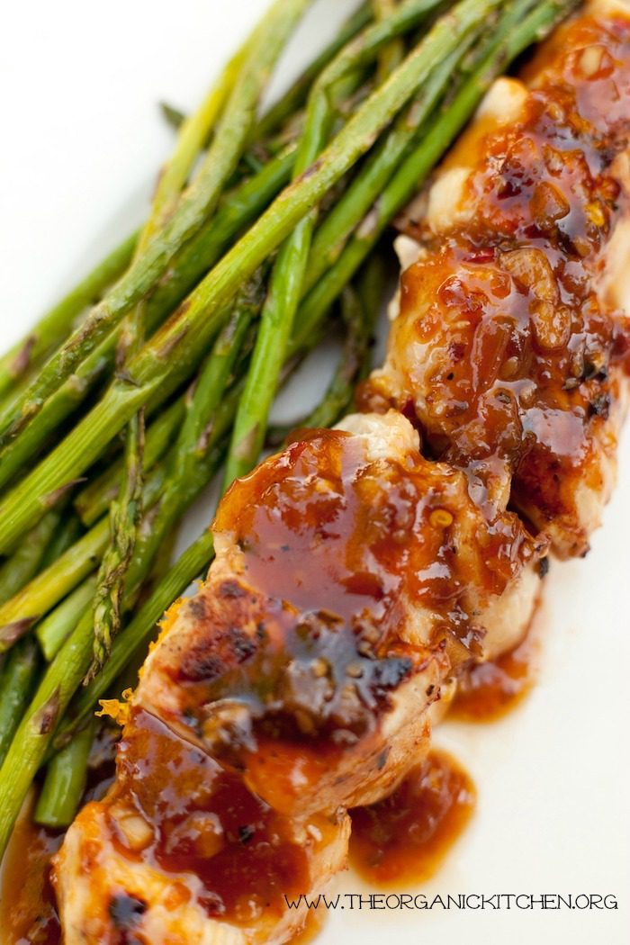 Grilled Apricot Chicken Skewers with asparagus on a white plate as part of 10 Delicious Grilling Recipes