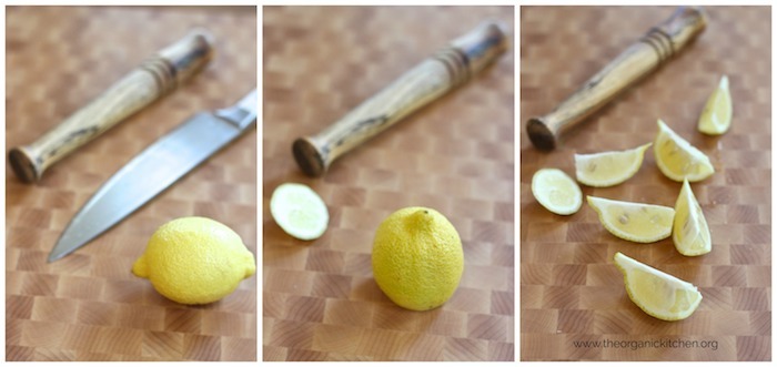 A knife, muddling tool, and lemon on a cutting board for use in Lemon Basil Spritzer~ Non Alcoholic "Mocktail" 