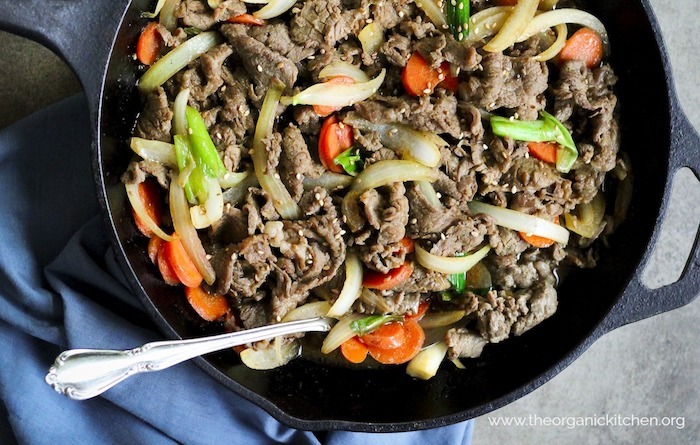 Paleo/Whole40 Korean BBQ Beef (Bulgogi) in black skillet with silver spoon