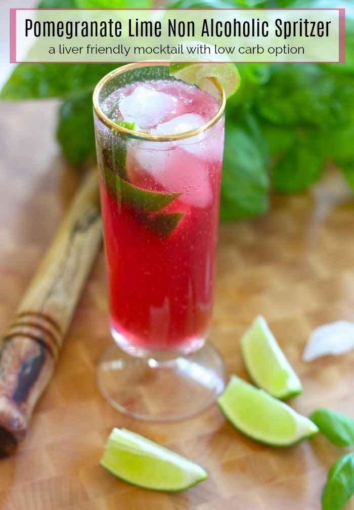 Pomegranate Lime Non-Alcoholic Spritzer in tall glass, surrounded by lime wedges and basil