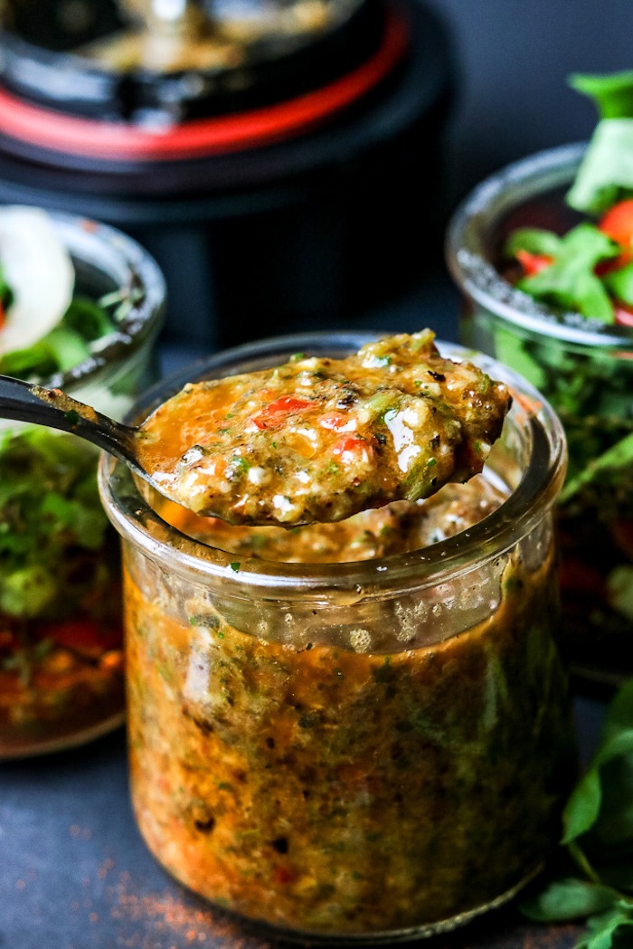 A jar of Haitian dipping  sauce with a spoon as part of  20+ Whole30 Dips, Sauces and Salad Dressings! 