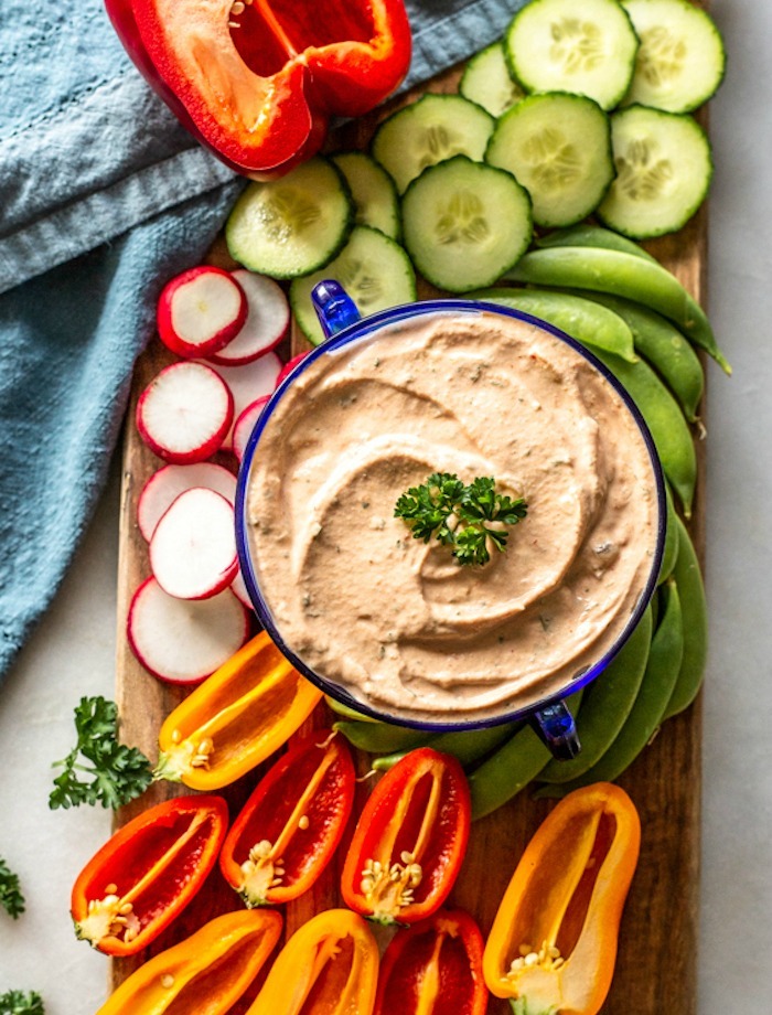 A bowl of 1000 Island Dressing surrounded by vegetables as part of 20+ Whole30 Dips, Sauces and Salad Dressings! 