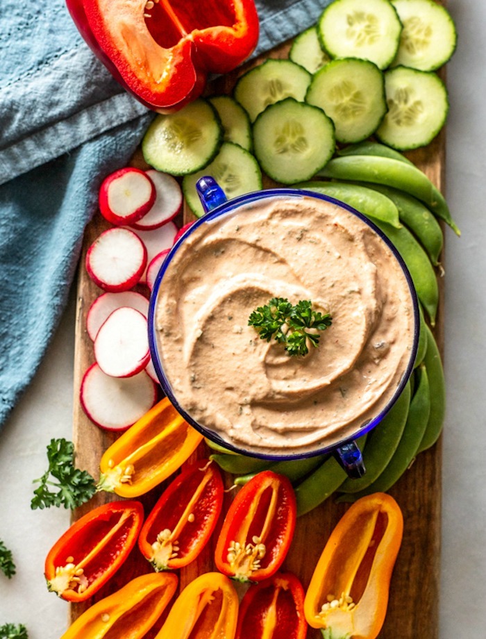 A bowl of 1000 Island Dressing surrounded by vegetables as part of 20+ Whole30 Dips, Sauces and Salad Dressings! 