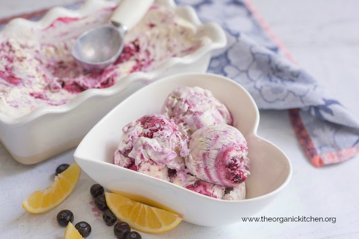 Blueberry Swirl Ice Cream in white serving dish and white heart shaped bowl on white surface