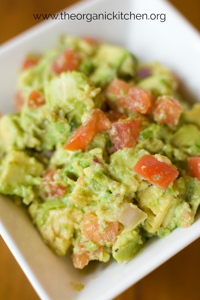 A white bowl of guacamole to be used as a side for Grilled Skirt Steak and Veggies with Guacamole