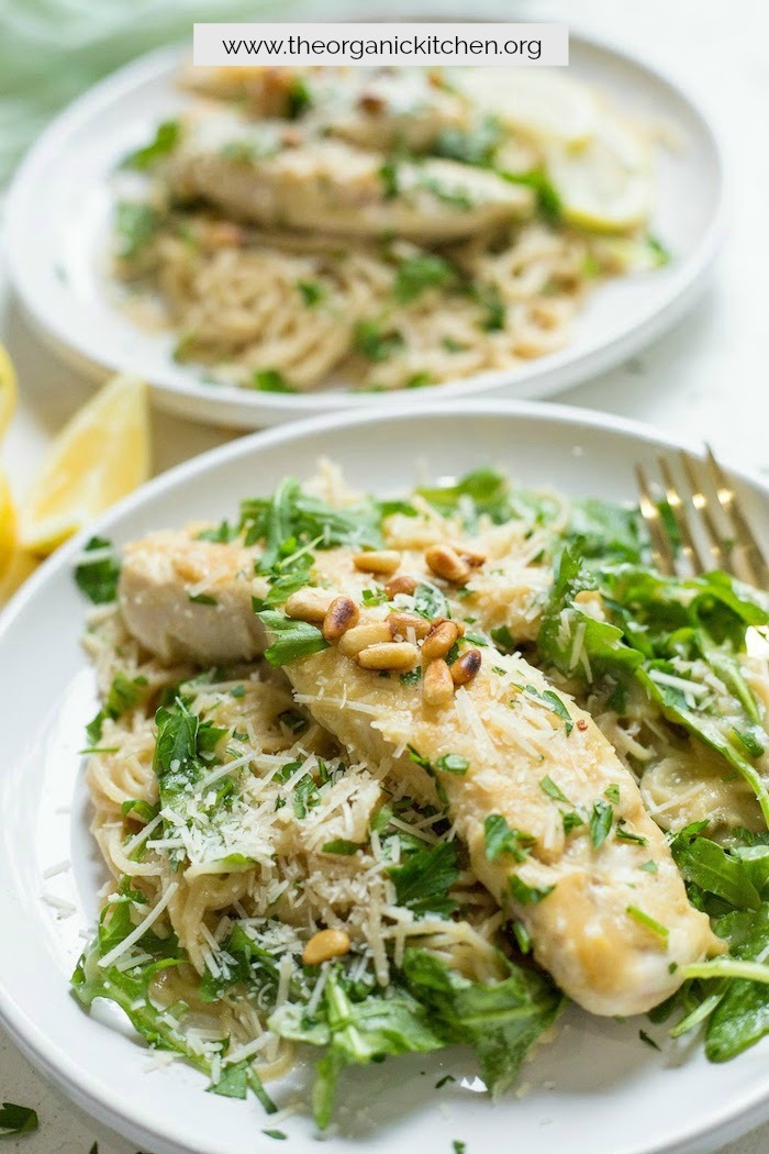 Easy Chicken Piccata with Baby Arugula garnished with pine nuts