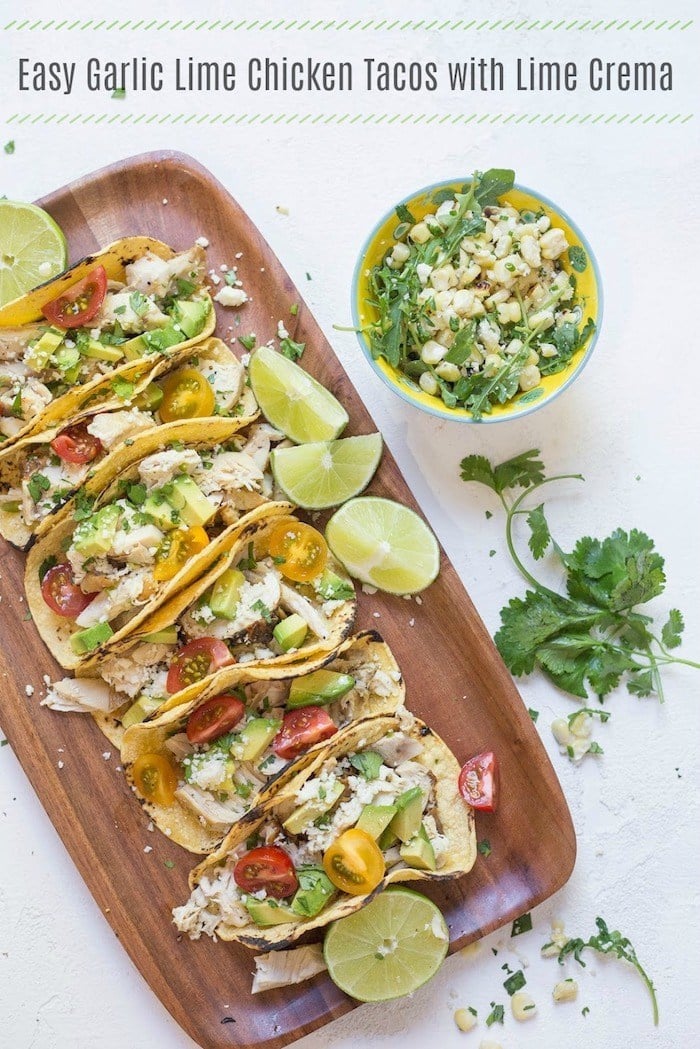 Easy Garlic Lime Tacos with Lime Crema on wood Platter!