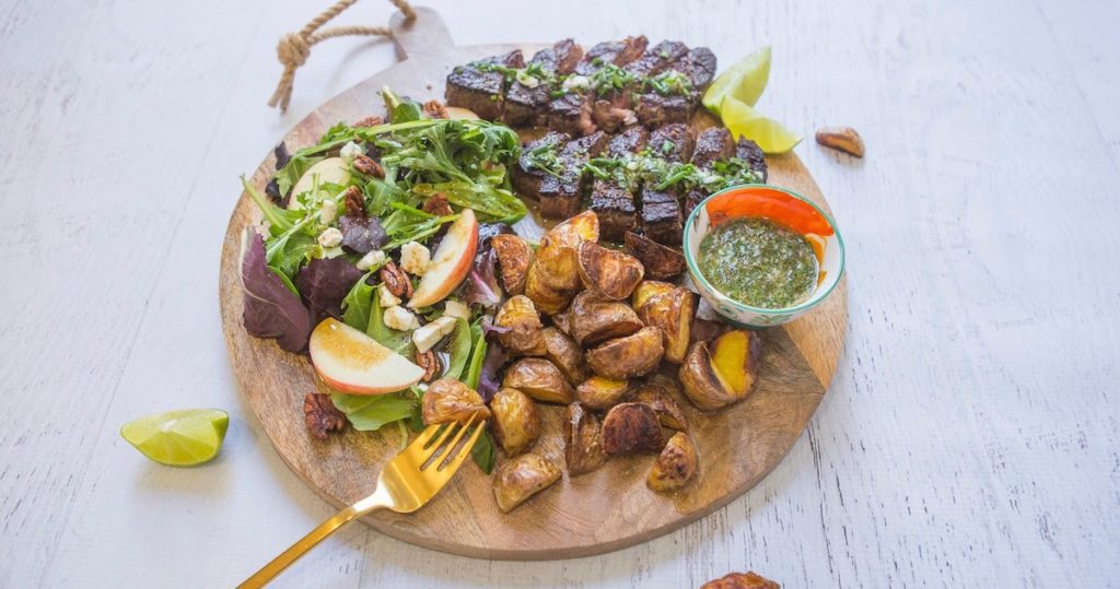 Syteak and potato board with salad