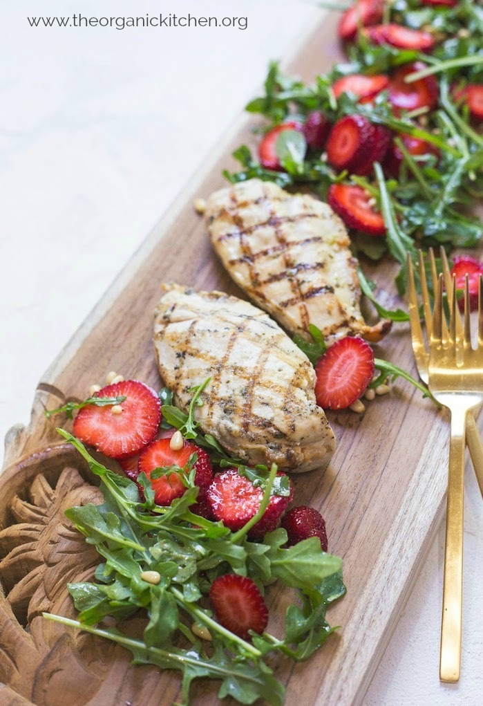Grilled Chicken with Strawberry and Arugula Salad on white backdrop