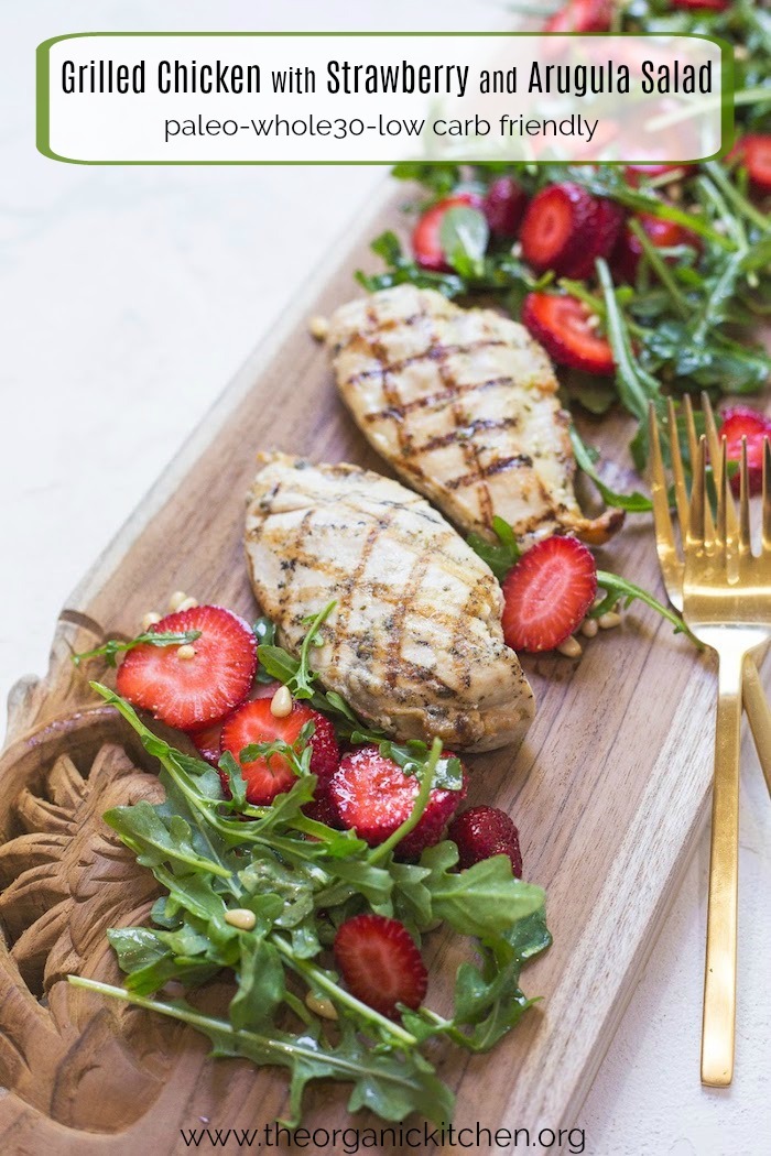Grilled Chicken with Strawberry and Arugula Salad on a wooden serving board