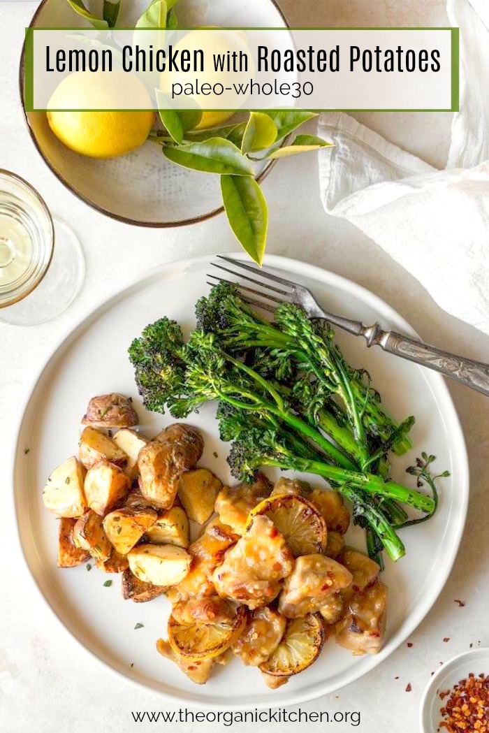 Easy Lemon Chicken with Roasted Potatoes on a round white plate with a bowl of lemons