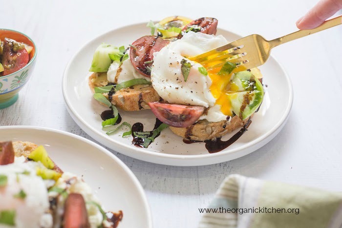 Heirloom tomato burrata toast with poached eggs