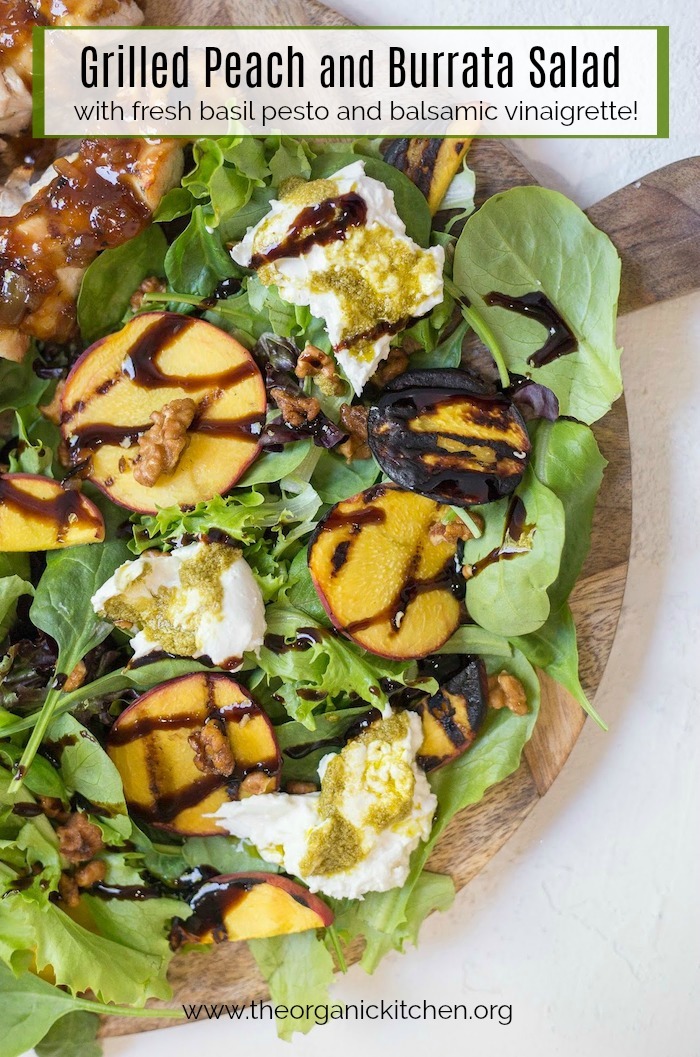 Grilled Peach and Burrata Salad on wooden serving board set on white background