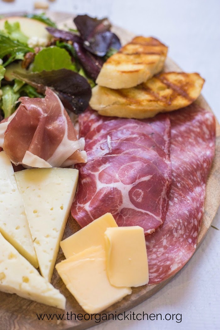 Salad and Charcuterie Board Dinner on white surface