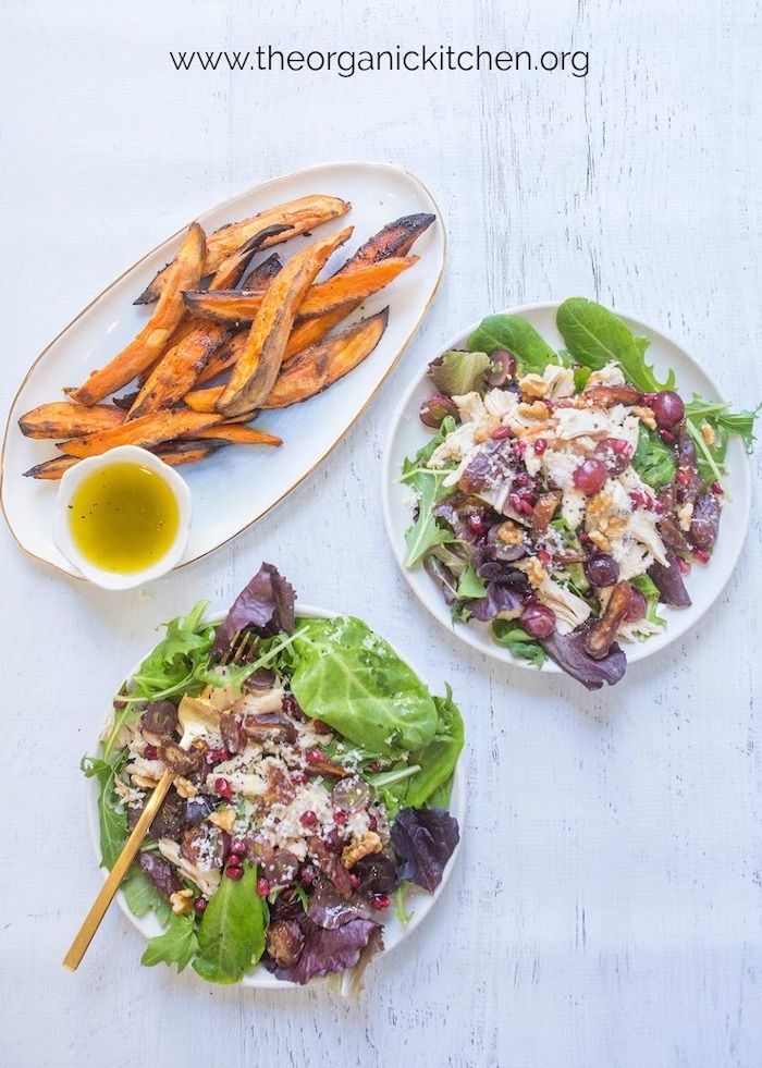 Chicken and Grape Salad with Roasted Sweet Potatoes on plates and platter with a small bowl of salad dressing