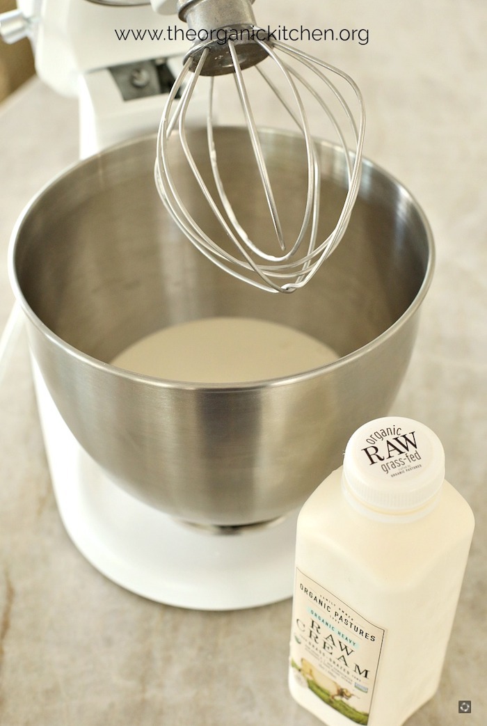 How to Make Raw or Pasteurized Butter: a KitchenAid mixer with cream in the bowl