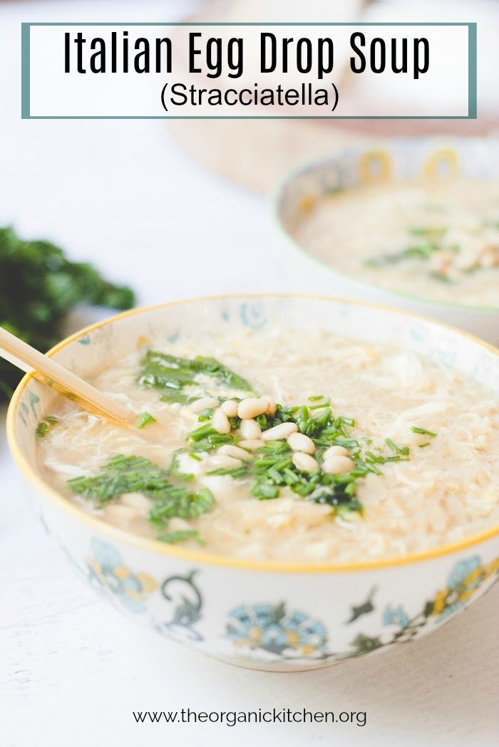 Italian Egg Drop Soup garnished with chives and pine nuts in pretty bowl 