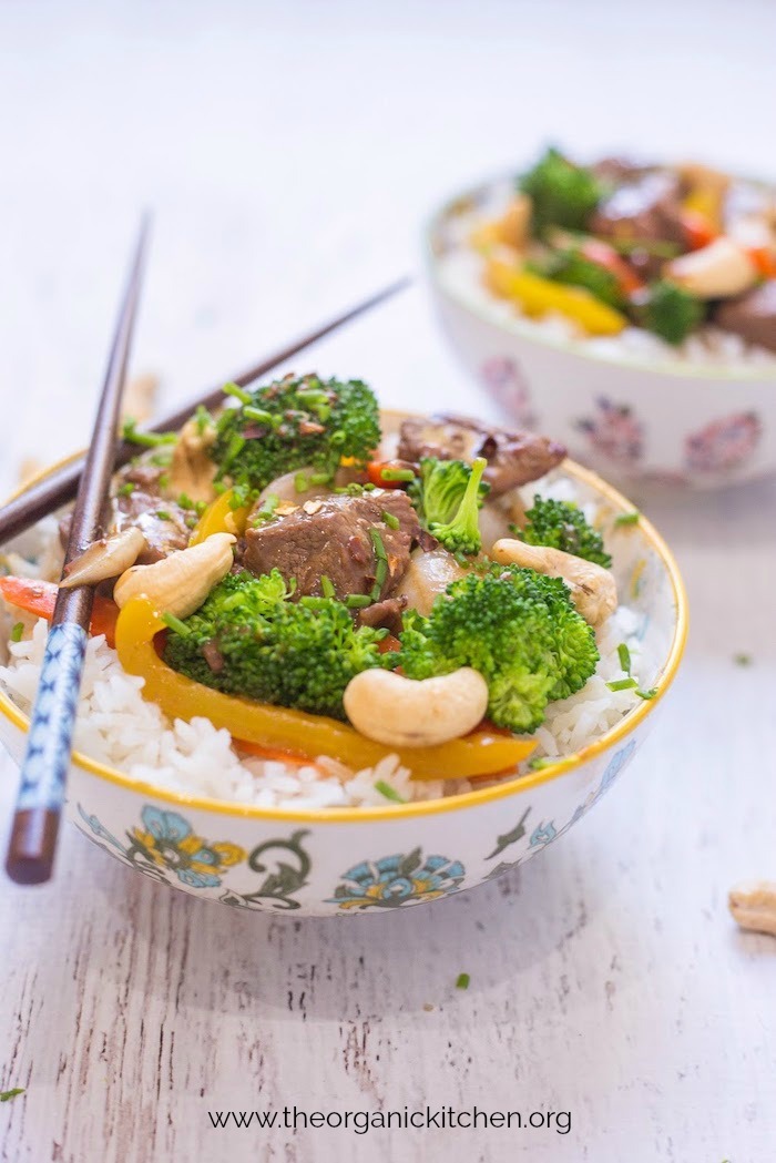 Two bowls Thai Beef and Broccoli Rice on white table