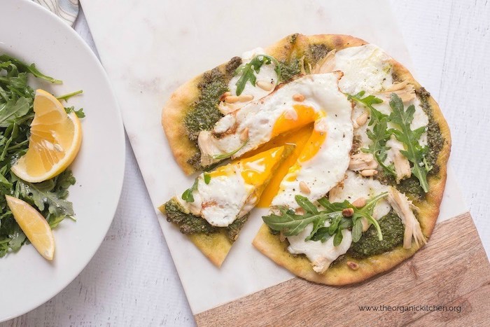 Chicken Pesto Burrata Naan Pizza with Fried Egg on marble serving board