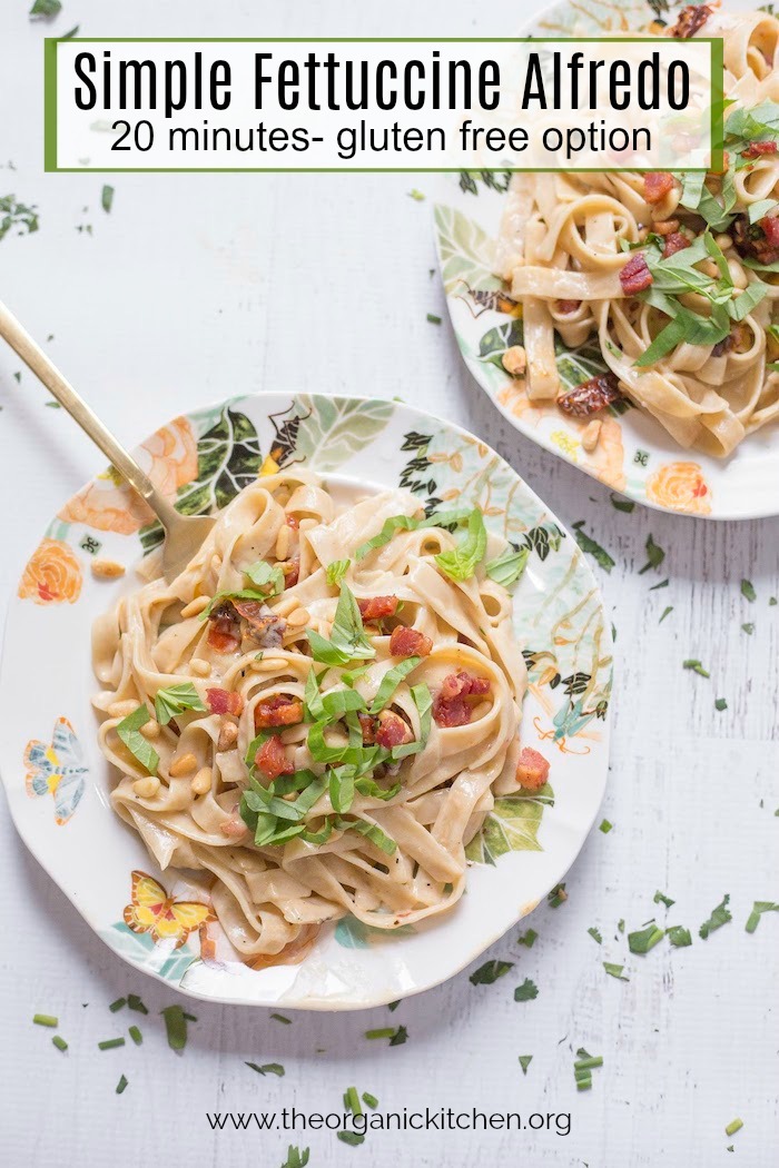 Simple Fettuccine Alfredo on a plate with gold fork