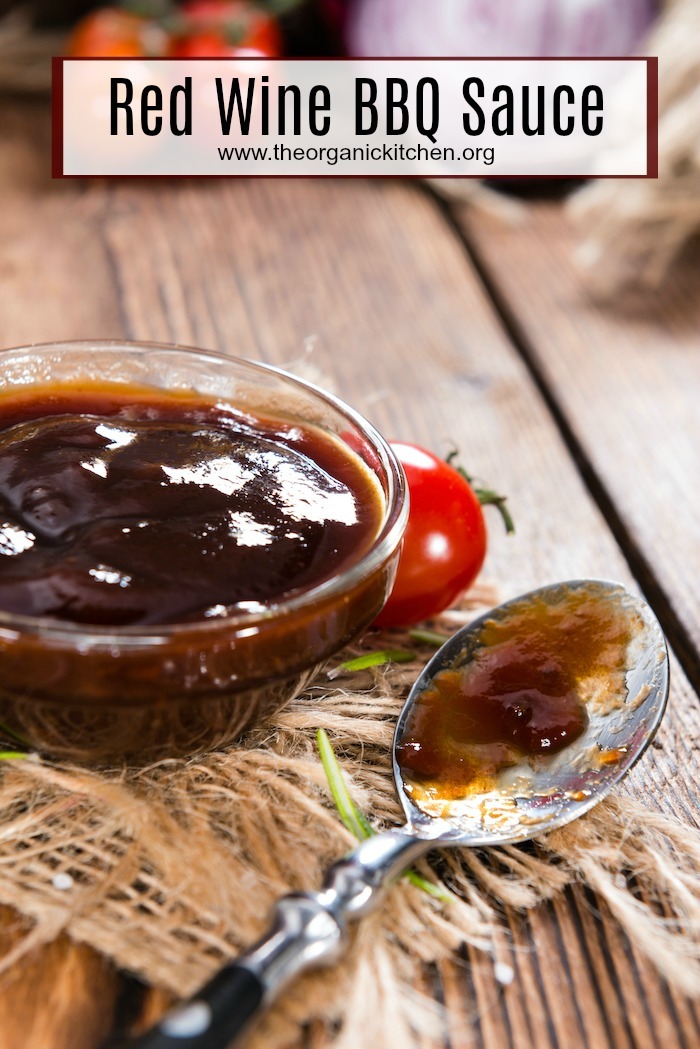 A small dish of Red Wine BBQ Sauce on wooden table