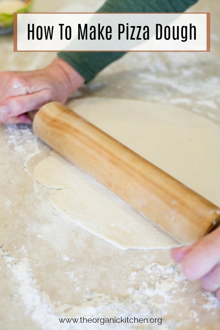 A woman's hands rolling pizza dough with a wooden rolling pin. How to make Homemade Pizza Dough 