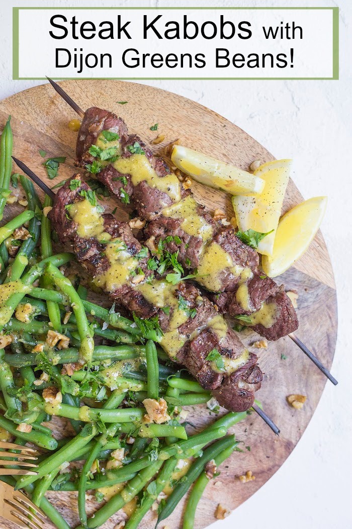 Steak Kabobs with Dijon Green Beans on wood paltter