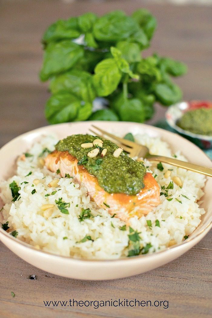 Pesto Salmon (Whole30-Keto-Low Carb) Pesto Salmon (Whole30-Keto-Low Carb) on cauliflower rice with herbs in the background